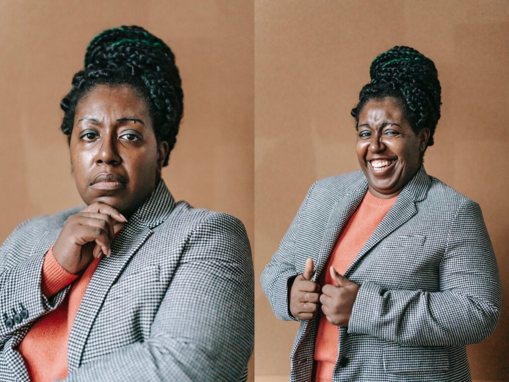 Professionally dress black woman smiling and posing in front of brown backdrop. dr. martin luther king