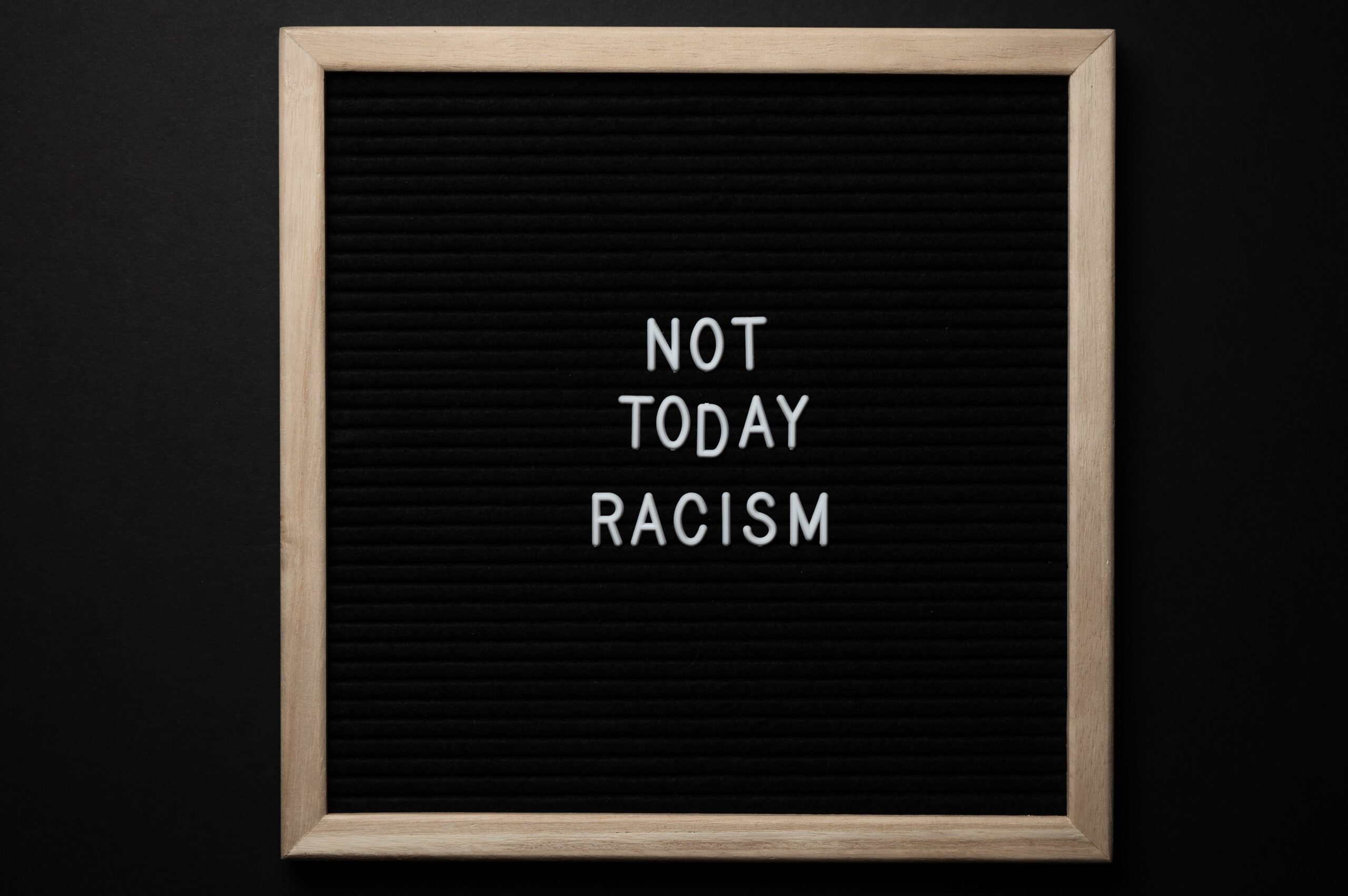 word board that reads Not today Racism. failing learning & growing
